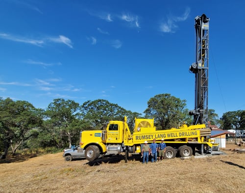 Ramsey-Lang family in front of their new Epiroc TH60 Water Well Drill Rig